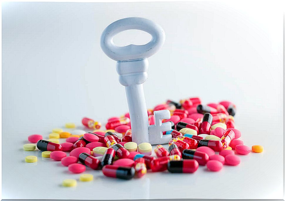 Assorted pills with a key