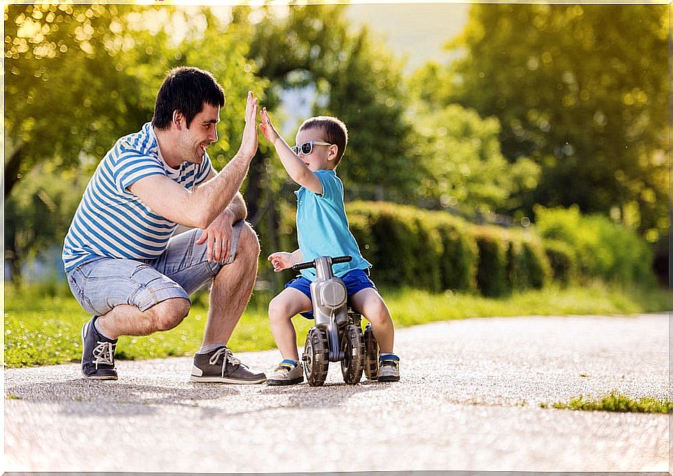 Father and son high-fiving
