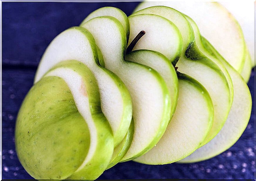 Green apple cut into the shape of hearts.